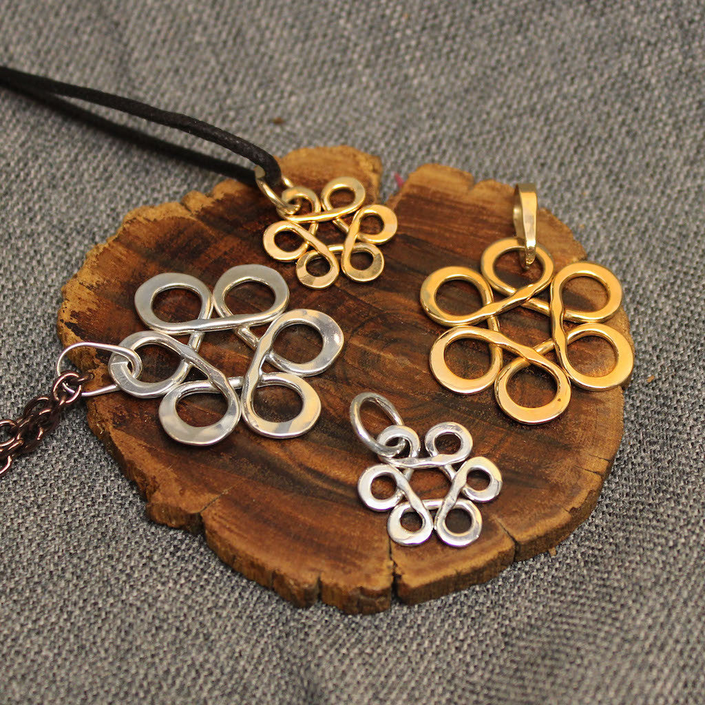 Small and large sterling silver and 14k gold pendants with Flower of Life design.