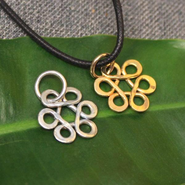 Sterling silver and 14k gold Flower of Life charm.