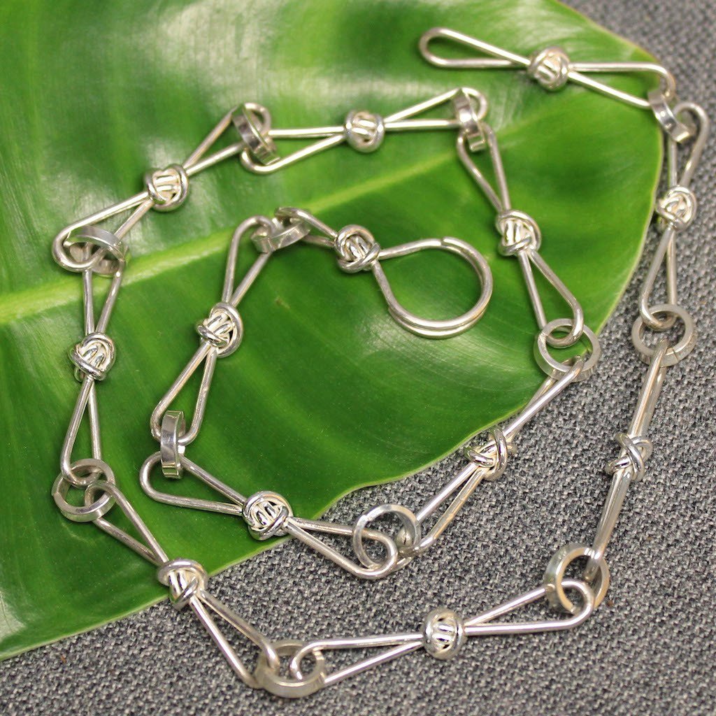 Sterling silver chain with love knot links.