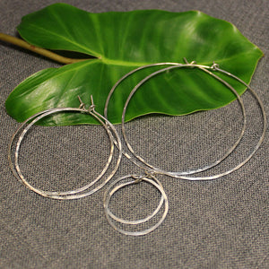 Small, medium and large sterling silver light hoops.