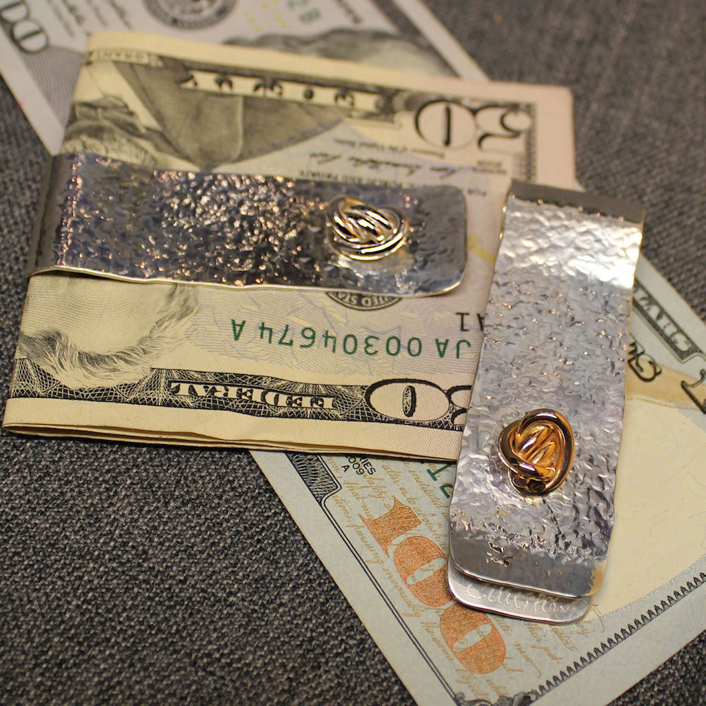 Sterling silver money clip with small round Crucian knot design.