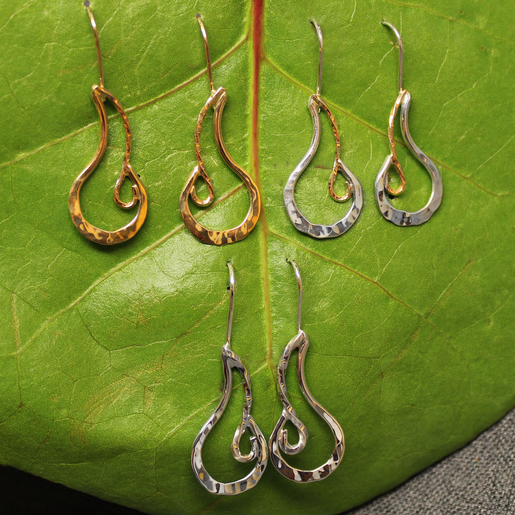 Sterling silver, 14k gold and Sterling silver with 14 gold hammered earrings with fire design.