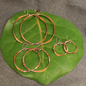 Small, medium and large handcrafted artisan copper hoop earrings.