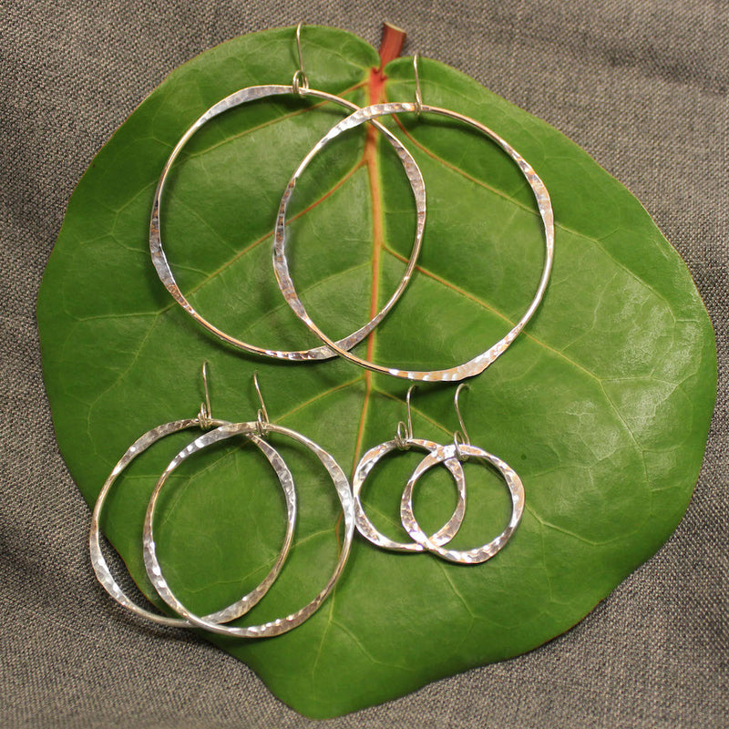 Small, medium and large handcrafted artisan sterling silver hoop earrings.