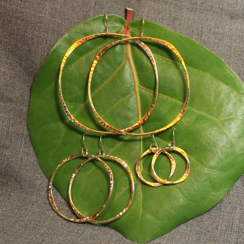 Small, medium and large handcrafted 14k gold hoop earrings.