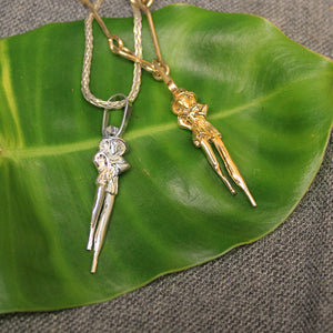 Sterling silver and 14k gold Moko Jumbie pendants.