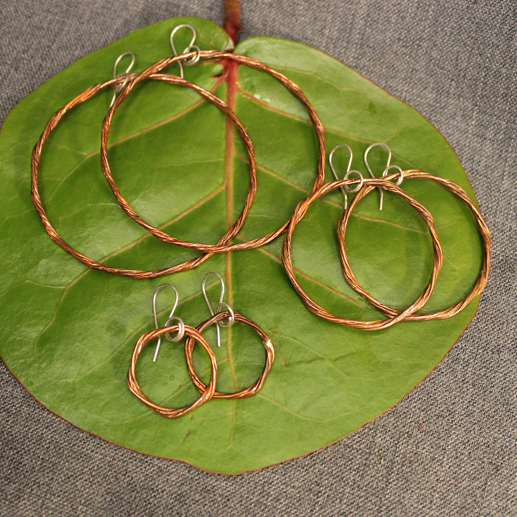 Handcrafted small, medium and large copper hoop earrings. 