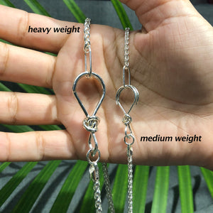 Sterling silver heavy wheat chain with love knot clasp.
