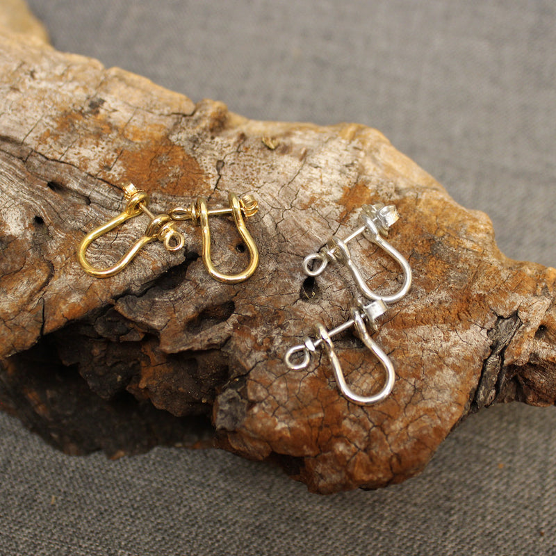 Sterling silver and 14k gold Sailor's Shackle earrings.