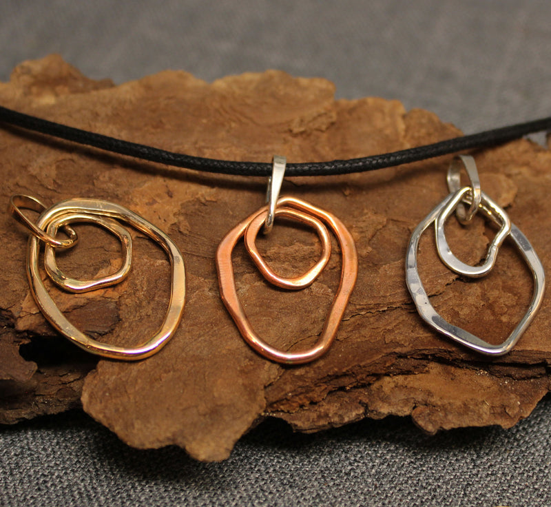 Copper, sterling silver and 14k gold shard shaped pendants.