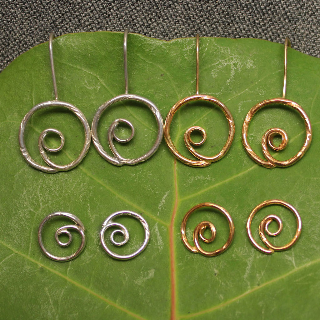 Sterling silver and 14k gold spiral earrings.
