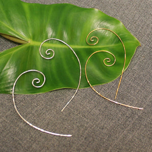 Sterling silver and 14k gold thin spiral wire earrings.