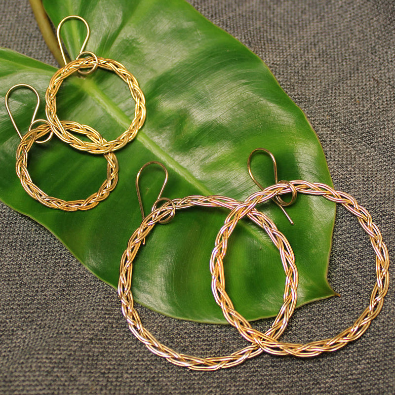 Small and large 14k gold hoop earrings with rope design.