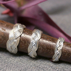 Small, medium and large sterling silver rings with Turkshead knot rope design.