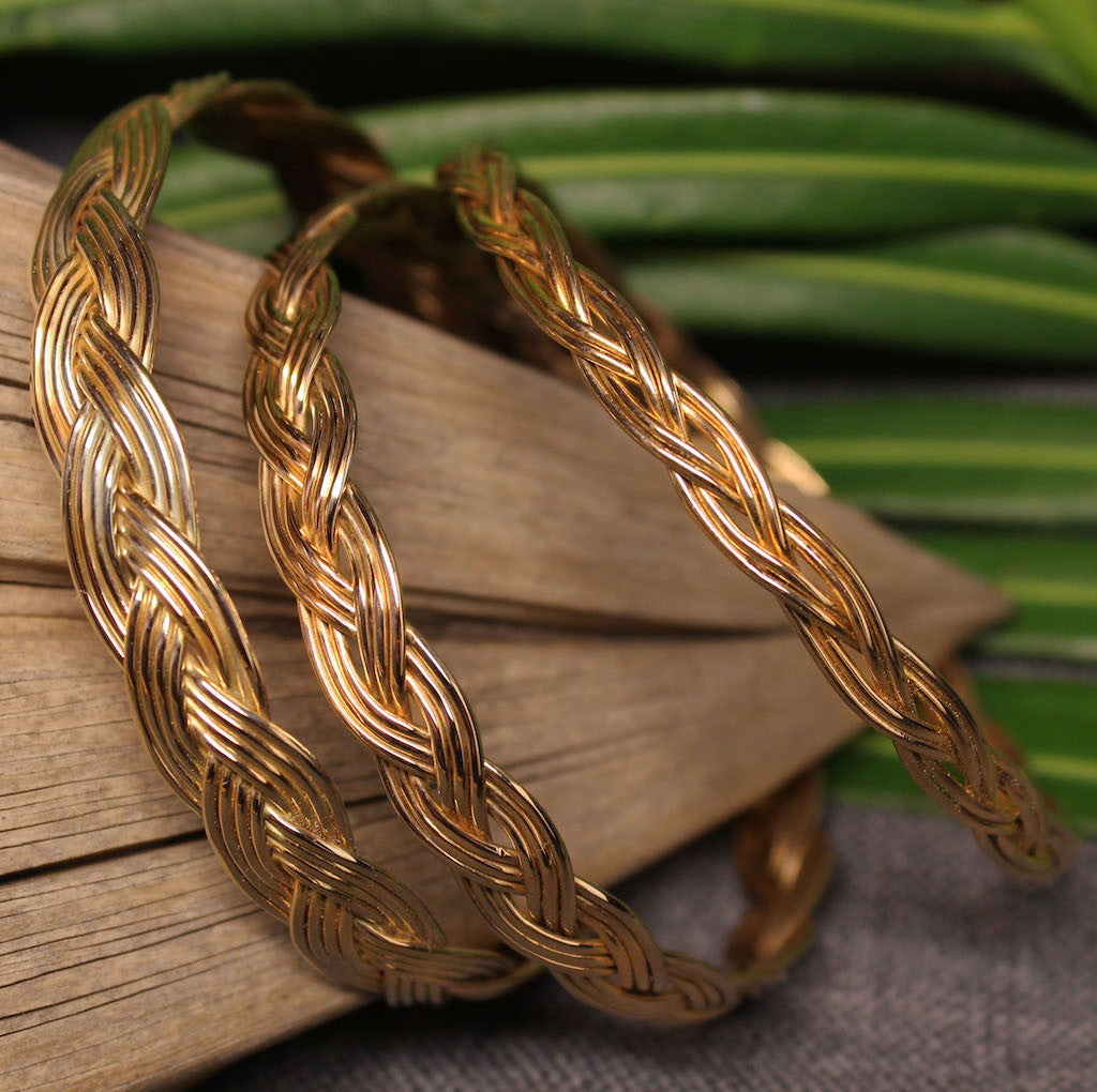 Small, medium and large 14k gold bangles with Turkshead knot rope design.