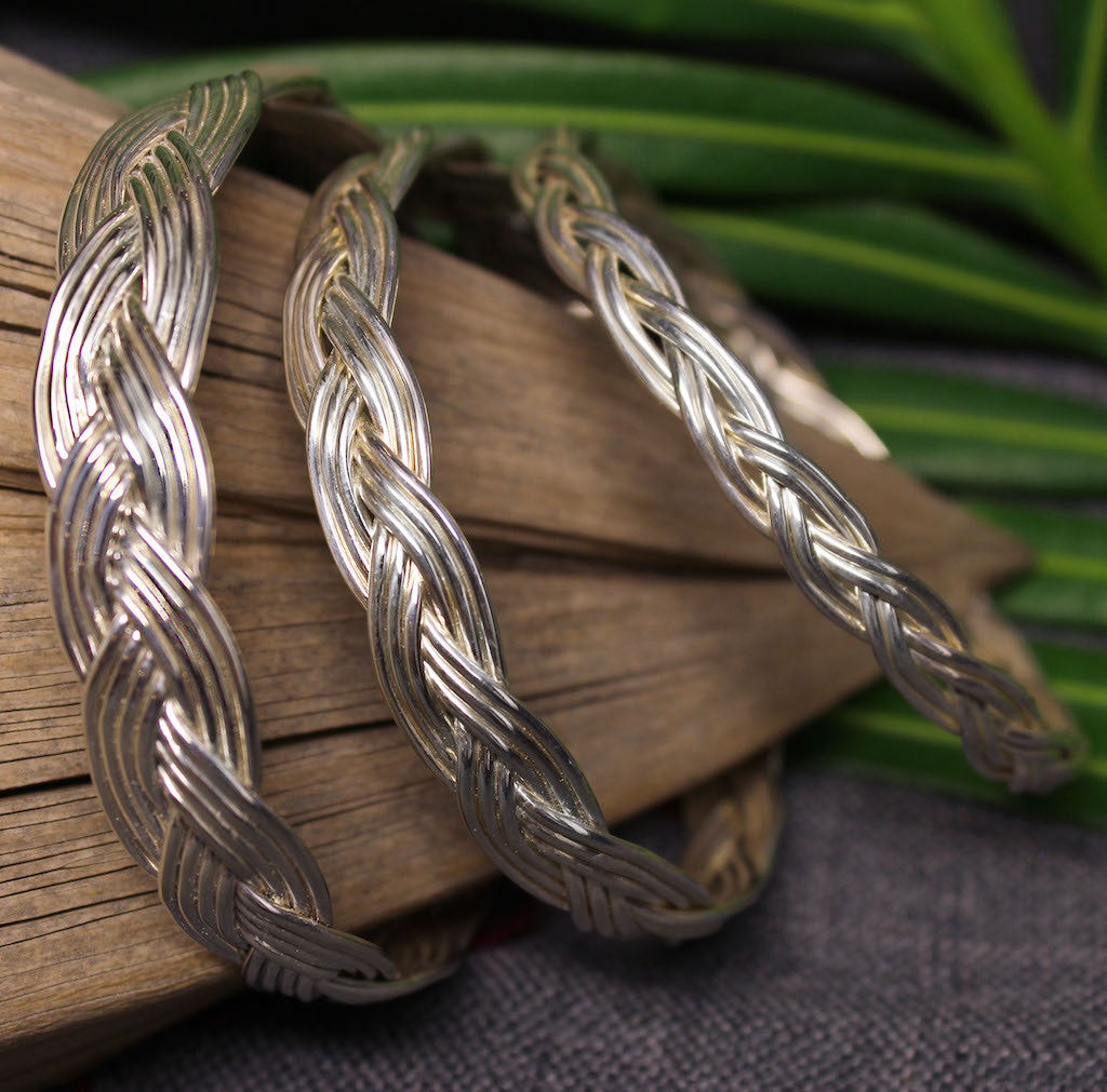 Small, medium and large sterling silver bangles with Turkshead knot rope design.
